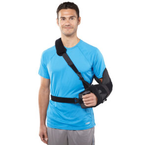Man wearing a black arm sling and a blue t-shirt.
