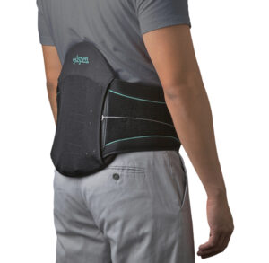 Man wearing a black lumbar support brace around his lower back.