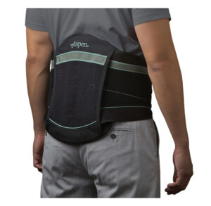 Person wearing a black lumbar support belt around the lower back.