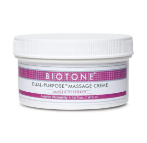 Jar of Biotone All Purpose Massage Creme with white lid and pink label.