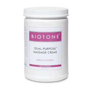 Jar of Biotone Dual-Purpose Massage Cream with white and pink label.