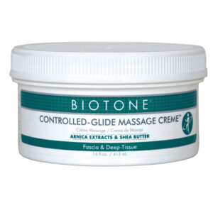 Container of Biotone Controlled-Glide Massage Creme with arnica extract and shea butter.