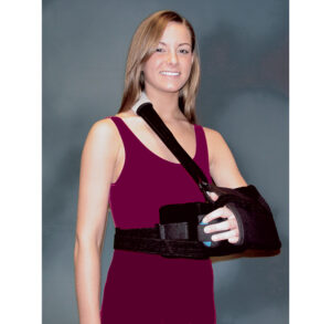 A woman in a burgundy dress with her arm in a black sling.