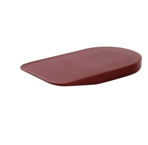 A maroon-colored, flat, curved plastic object.