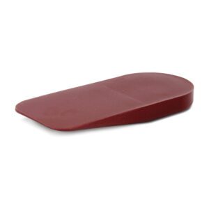 Red rubber doorstop wedge on white background.