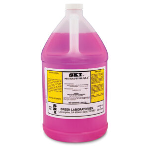 A gallon jug of pink cleaning solution with a label.