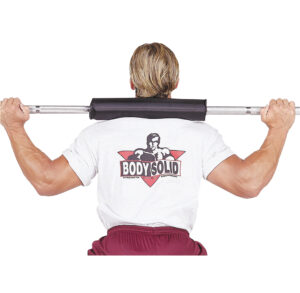 Man holding a barbell behind his neck, wearing a white shirt with a graphic design.
