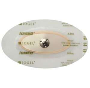 Transparent adhesive medical dressing with a central metal button.