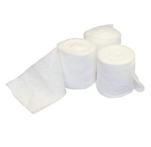 Three white rolled medical gauze bandages with one partially unrolled.