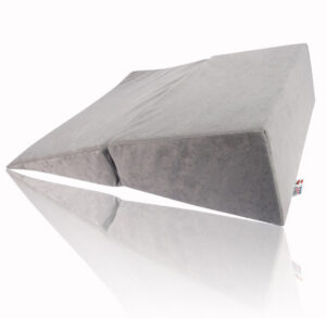 A gray fabric wedge pillow with a split design.