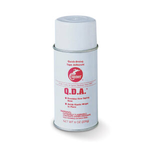 Spray can of Q.D.A. disinfectant cleaner with white and red labeling.