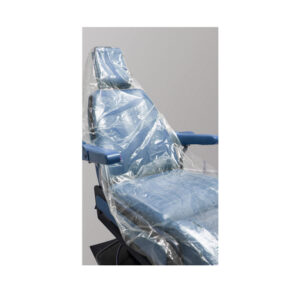 A dental chair covered in protective plastic wrap.