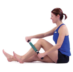 Woman using a massage roller on her leg muscles.