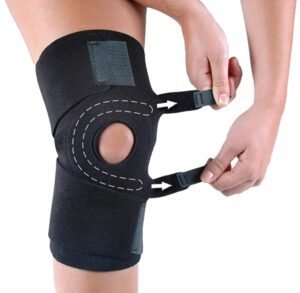 Adjustable knee brace with open patella for support and relief.
