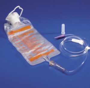 Medical urine collection bag with tubing and valve on blue background.