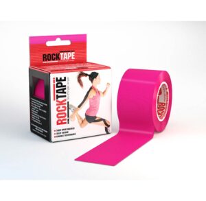 Bright pink kinesiology tape roll with packaging beside it.
