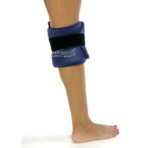 Person wearing a blue ankle weight on one leg, standing barefoot.