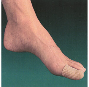 Foot with a bandaged toe against a solid background.