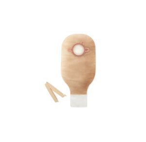 A beige ostomy bag with a circular opening and two clips beside it.