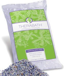 A bag of Therabath lavender-scented product with loose lavender flowers.