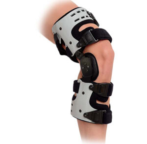 Adjustable knee brace with straps and hinges for support.