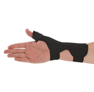 Black wrist support brace with thumb hole on a hand.